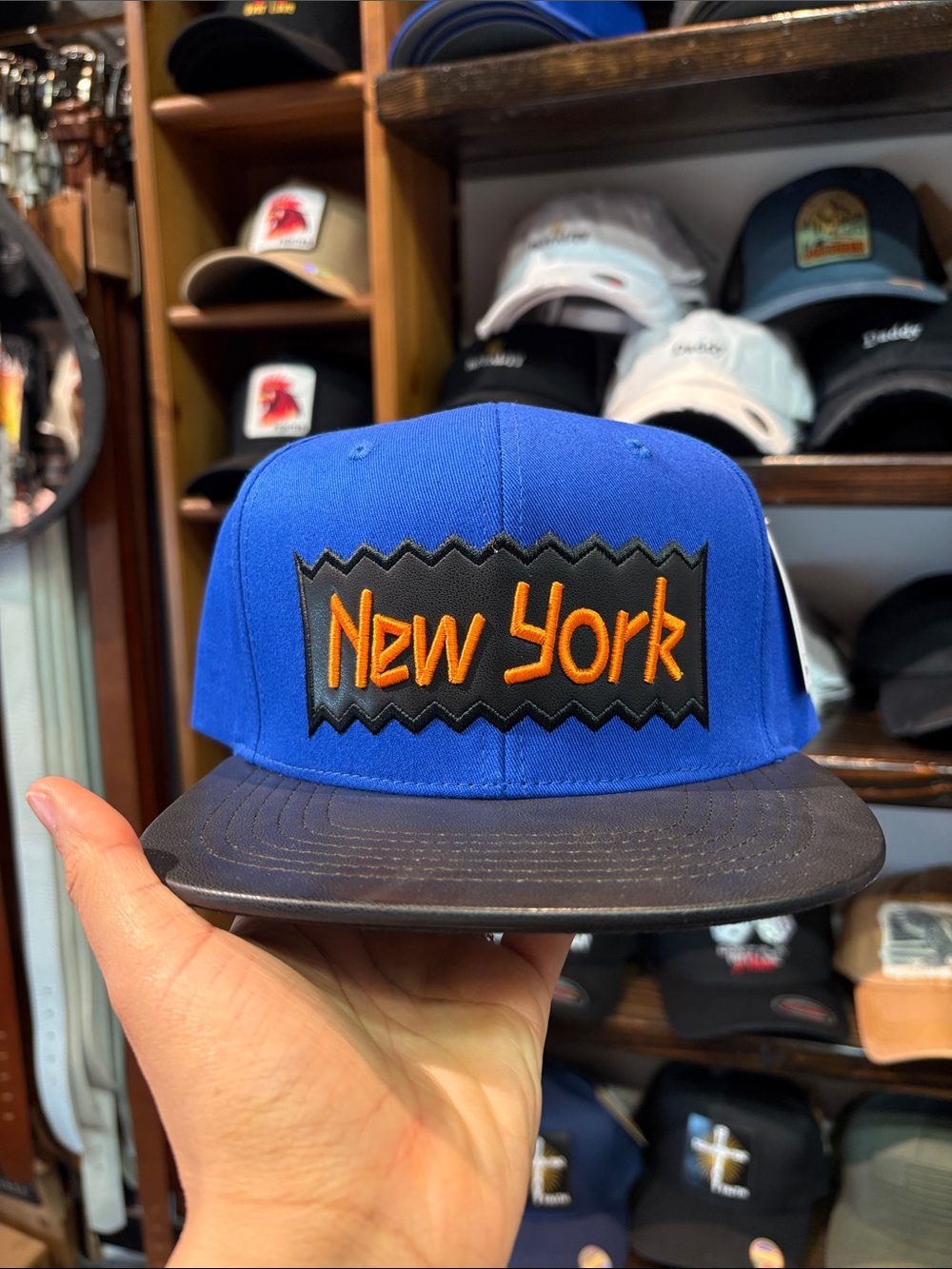 Blue 'New York' Snapback Cap with Orange Embroidery